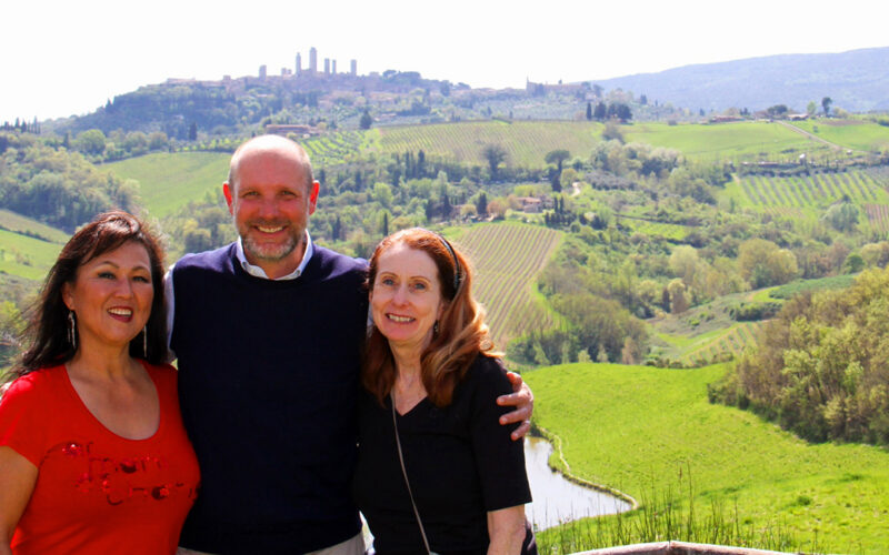 driver with two guests and san gimignano
