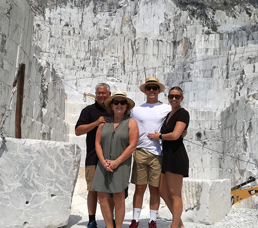 group of friends in front of a marble quarry
