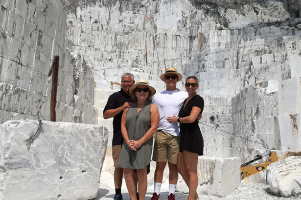 group of friends in front of a marble quarry