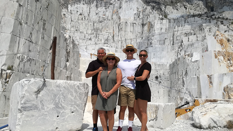 group of friends in front of a marble quarry