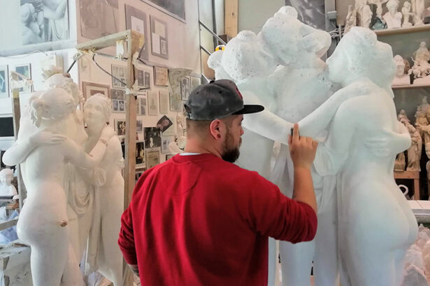 Sculptor at work on a marble statue