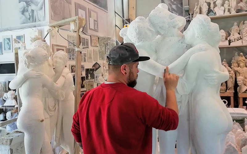 Sculptor at work on a marble statue