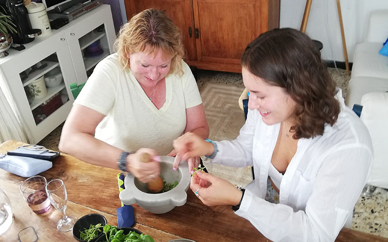 making the pesto old fashioned with marble mortar and pestle