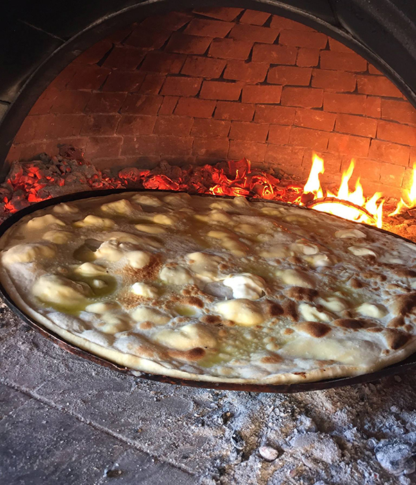 cheese foaccia just out of the wood oven